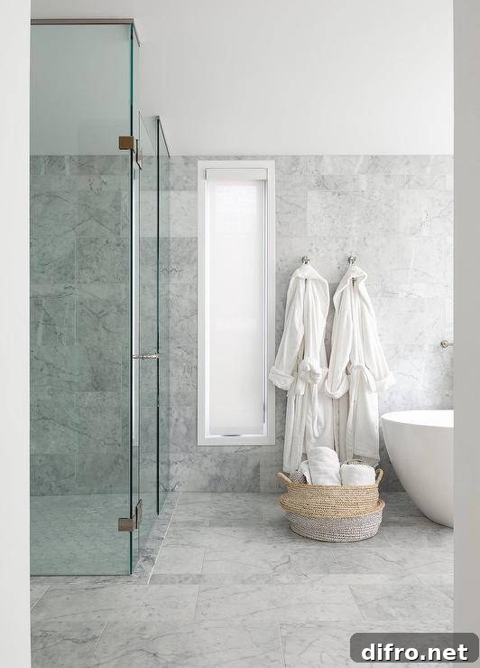 Marble bathroom with a clear partition walk-in shower