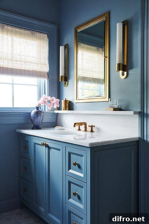 Contemporary bathroom with brass and marble accents