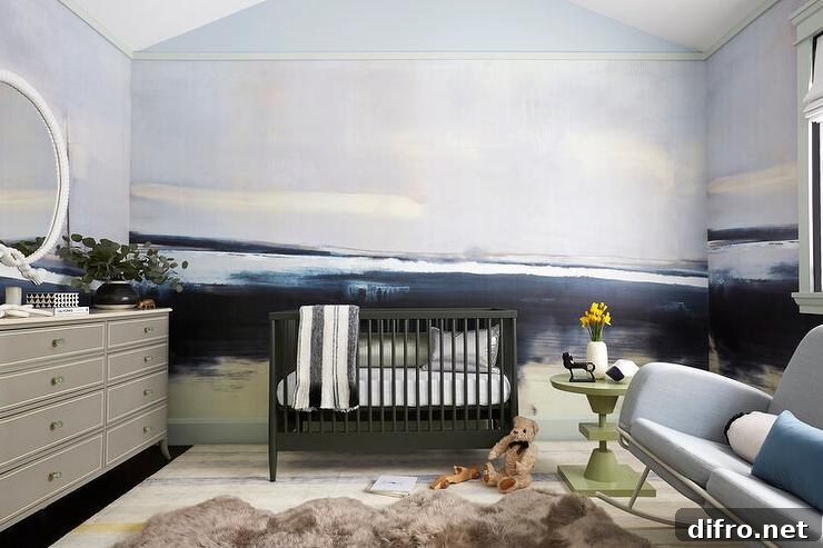 Contemporary blue and gray boy's nursery features black nursery crib, a gray French dresser, a light gray sofa rocker with green avocado accent table, a brown cowhide rug and a blue and gray wall mural.
