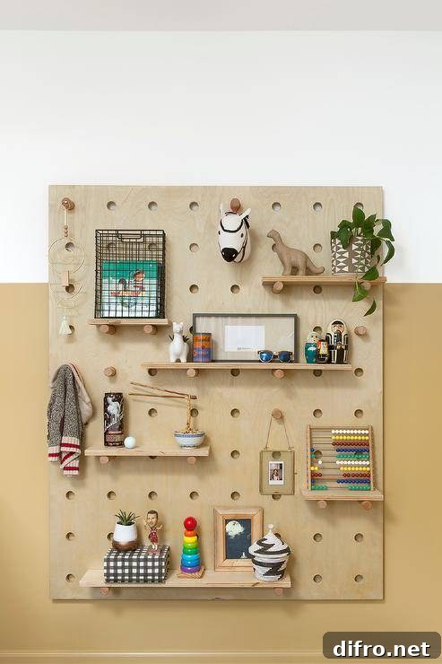 Boy nursery peg wall organizer on a mustard yellow nursery wall features vintage wood toys and fun accenting decor.