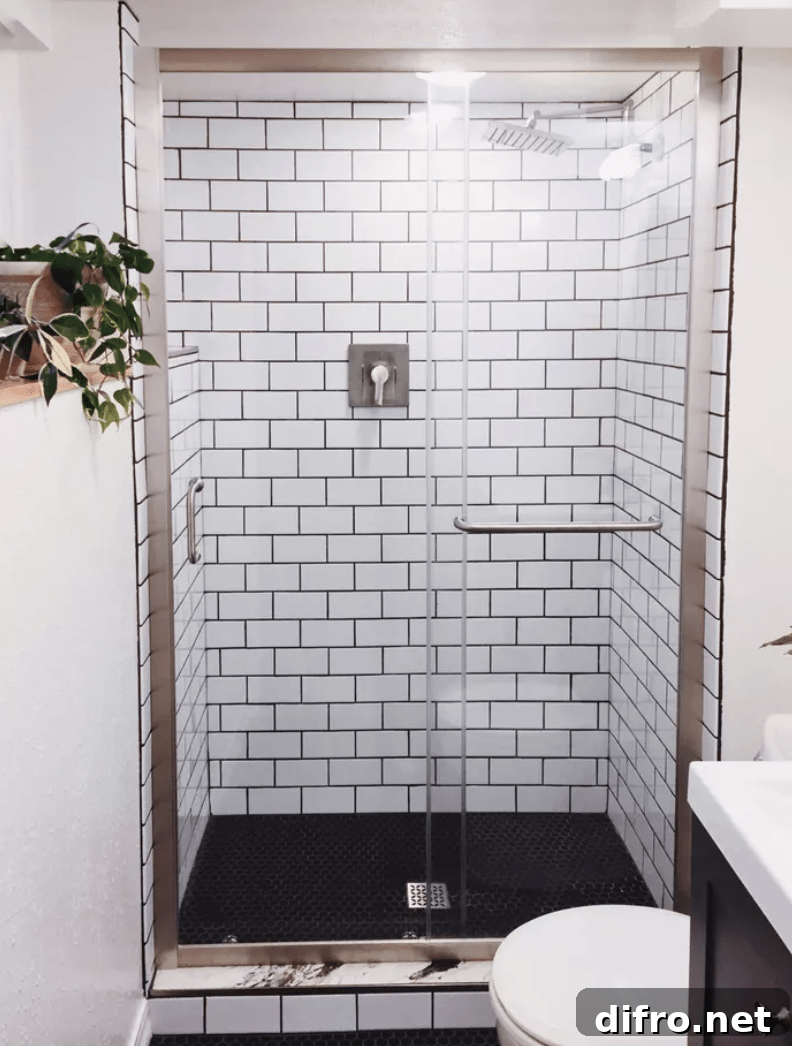subway tile in basement bathroom walk in shower with glass door