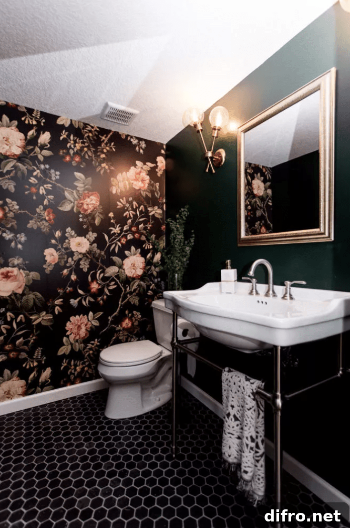basement bathroom with floral wallpaper green wall pedestal sink and toilet