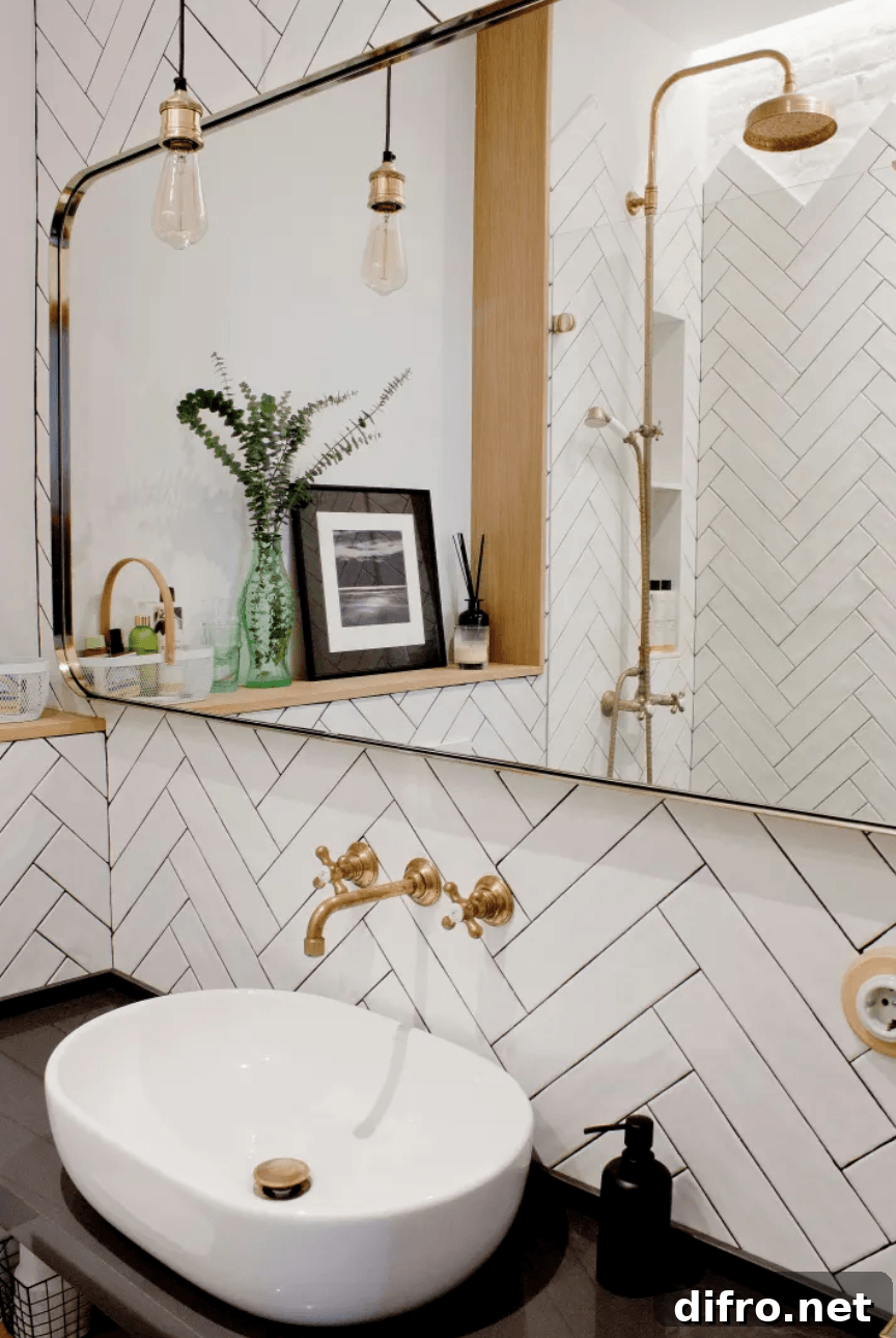 White Herringbone tile with gold faucets bowl sink showerhead