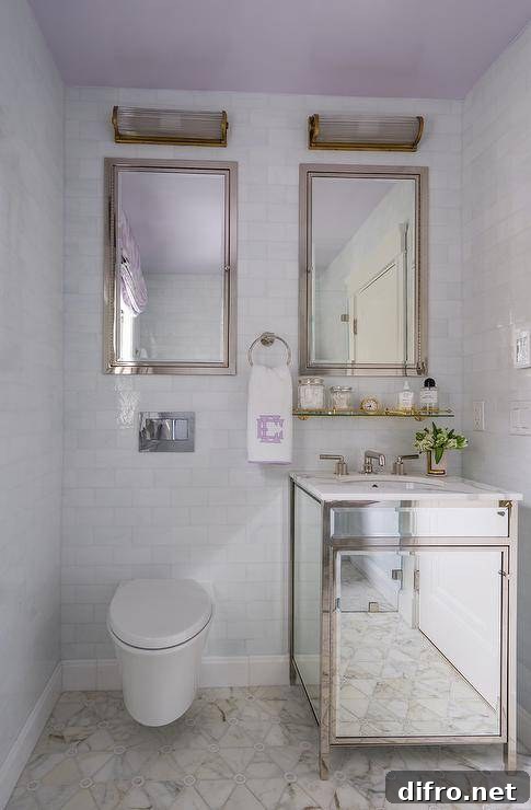 mirrored vanity reflecting light in small bathroom