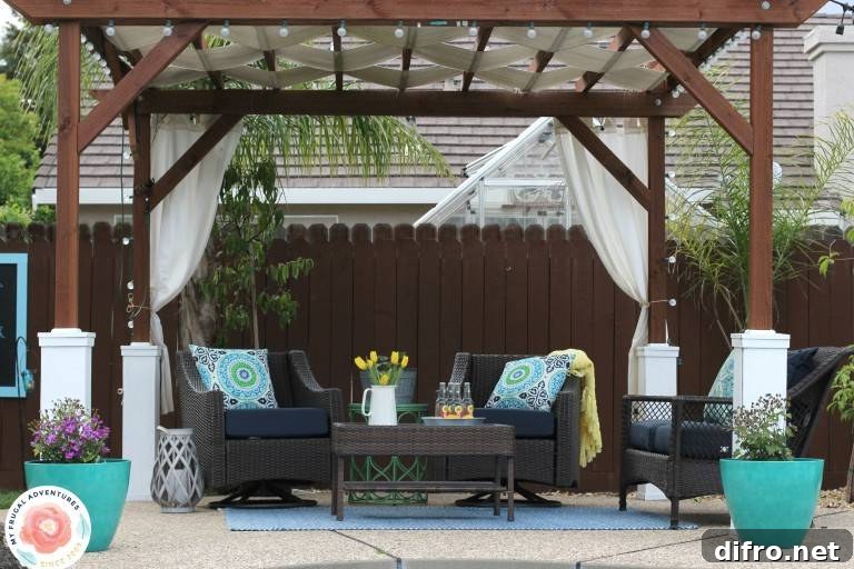 wide shot of pergola in backyard with patio furniture and turquoise blue pots