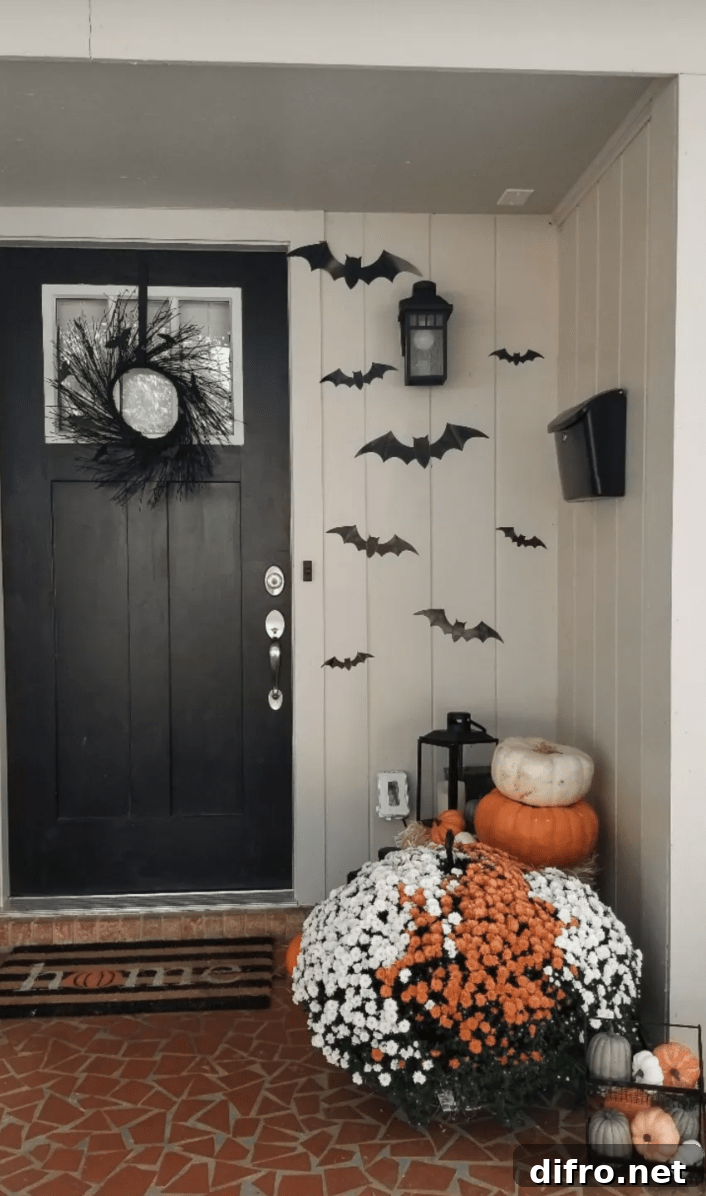 Simple Halloween porch with mums and pumpkins