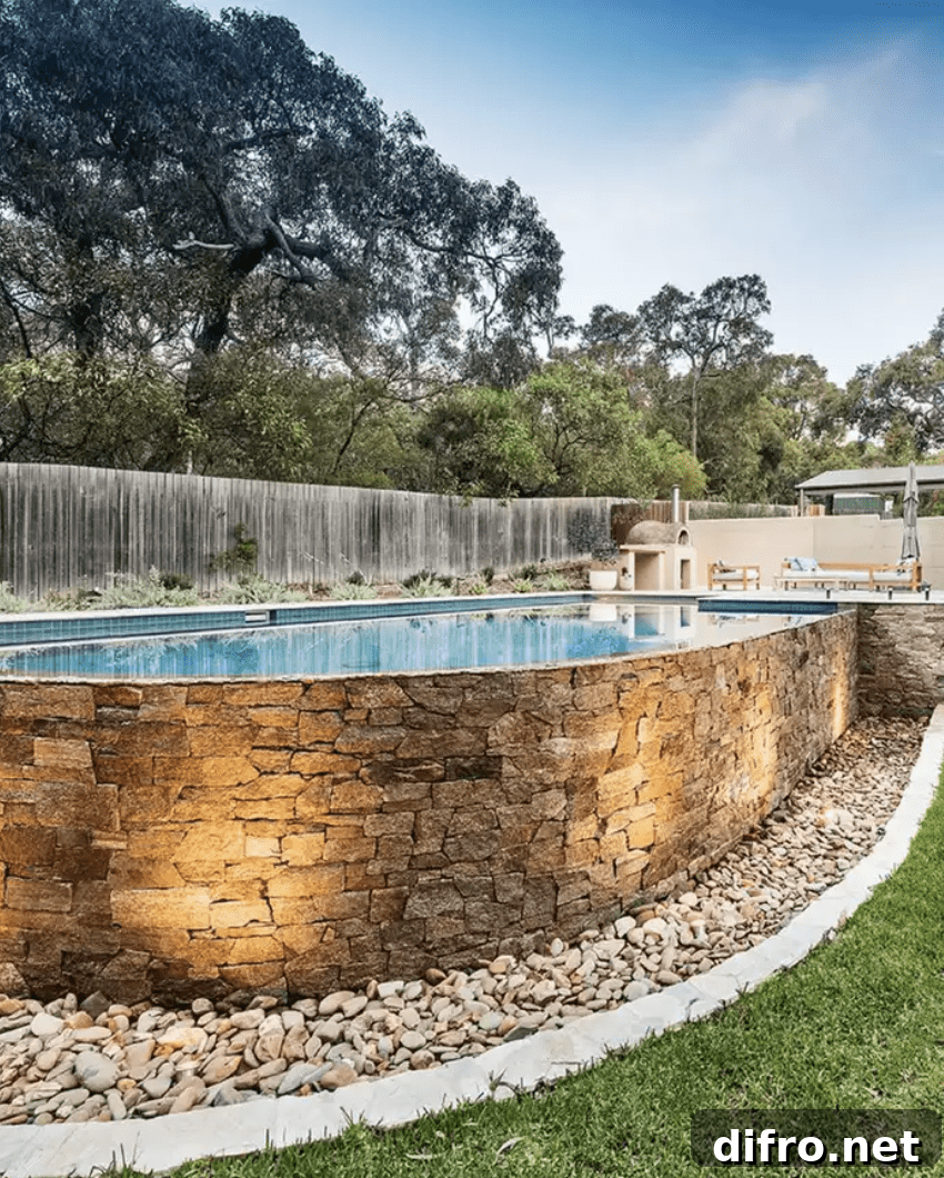 above ground pool with stone brick work wall and stones around the ground