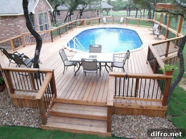 above ground pool framed in by large wood deck with seating and eating area patio furniture