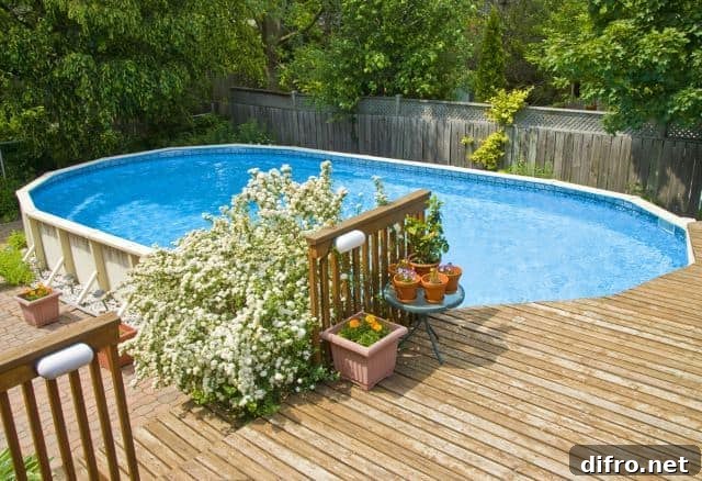 large oval above ground pool with deck
