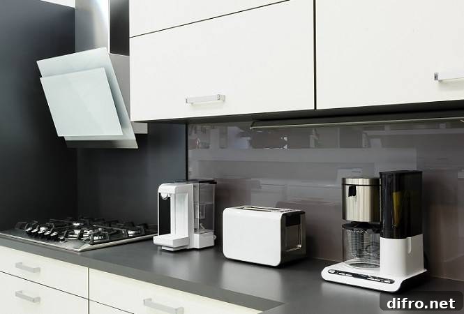 White modern kitchen cabinets with appliances on a counter.
