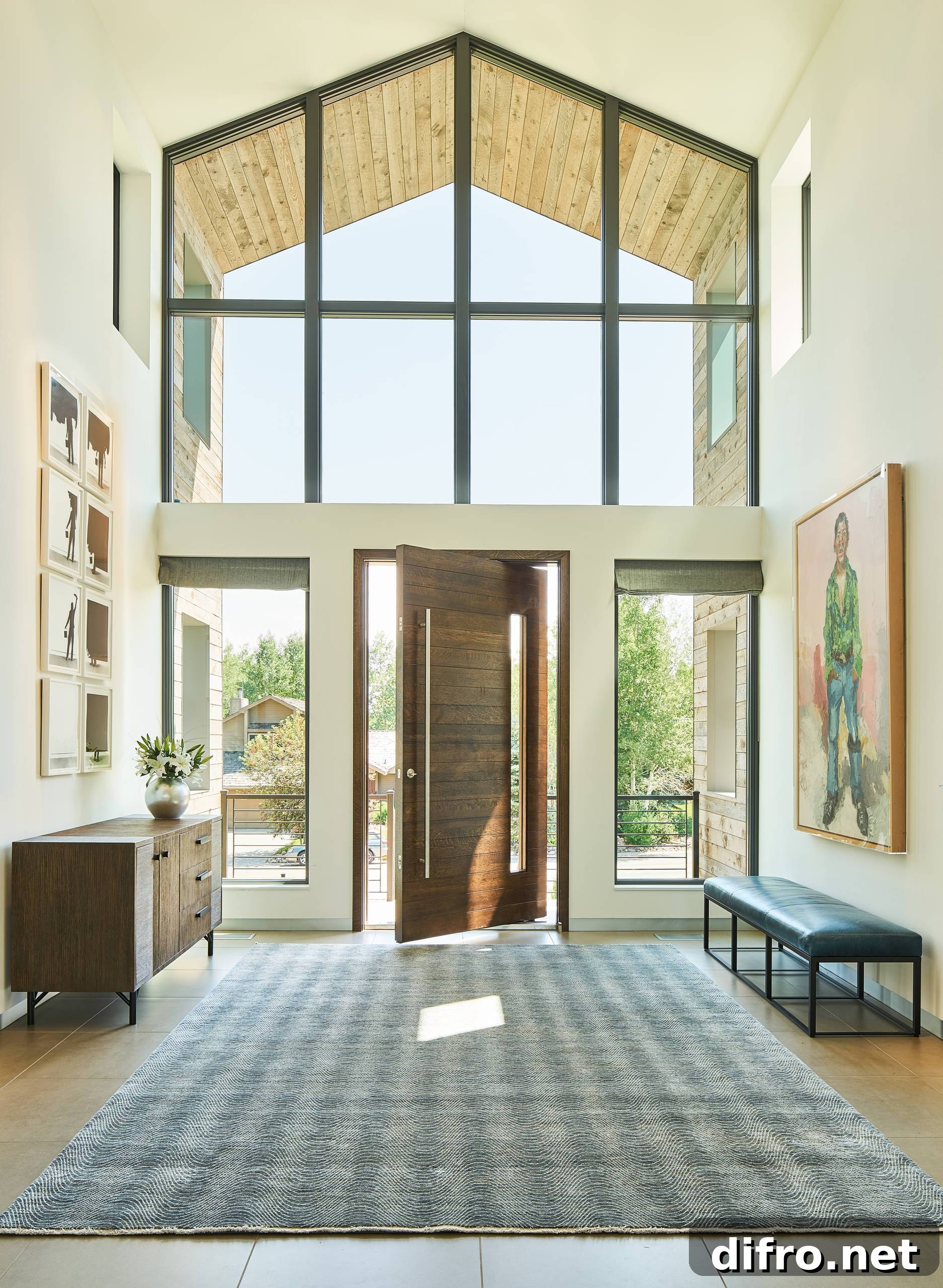 Large contemporary pivot front door in modern home
