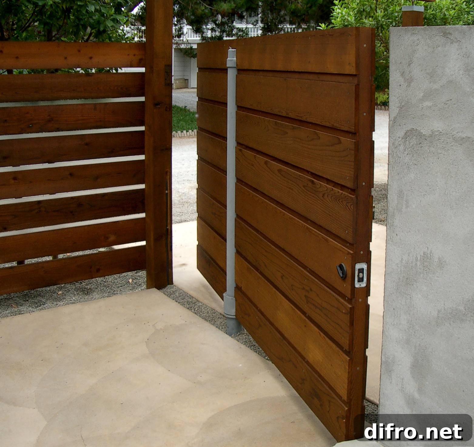 Modern garden pivot door that matches the fence