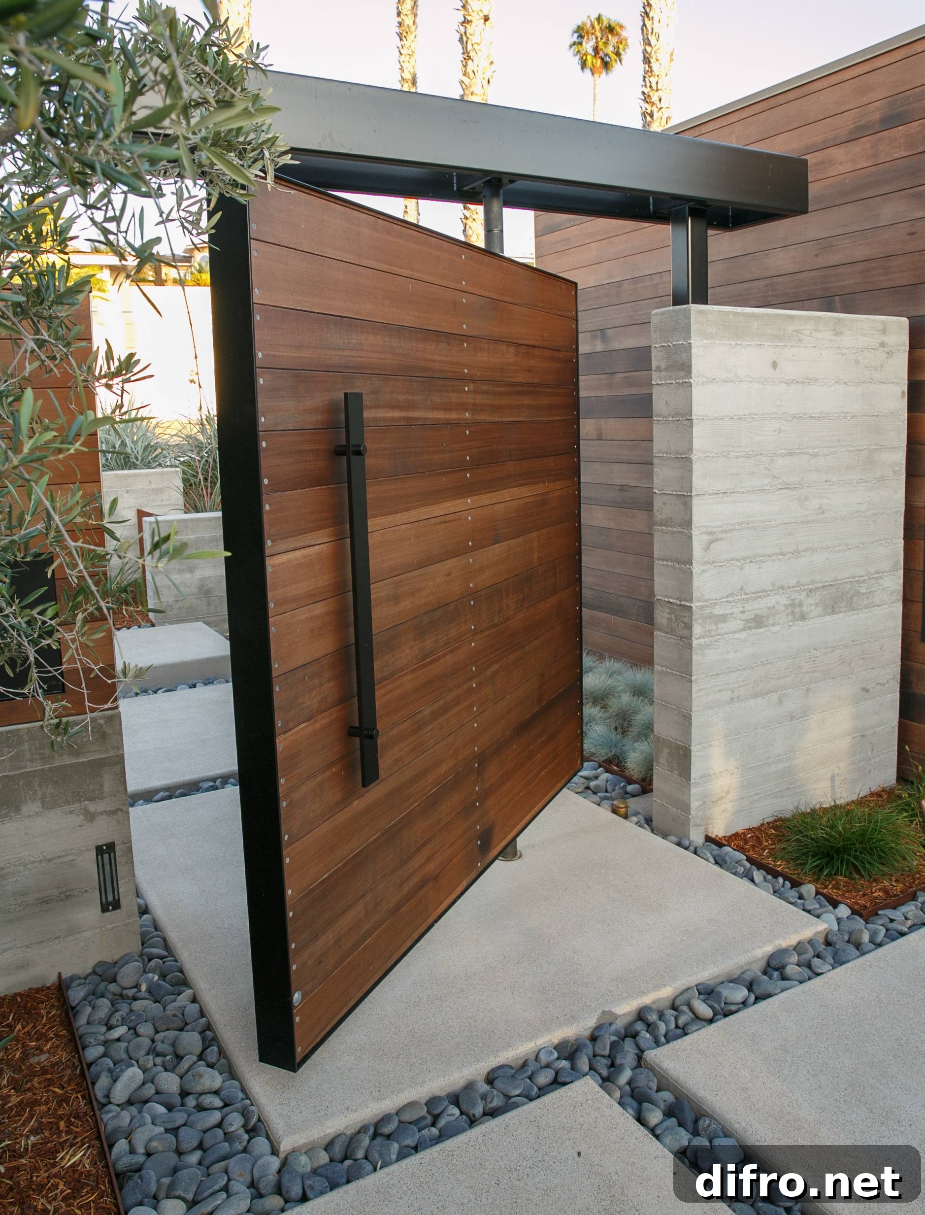 Wood-clad outdoor pivot door at a front entrance