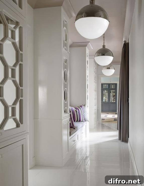 Contemporary hallway with a built-in bench and floor-to-ceiling mirrored cabinets