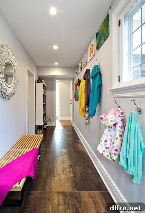 Family friendly hallway mudroom with open cubby storage and coat hooks