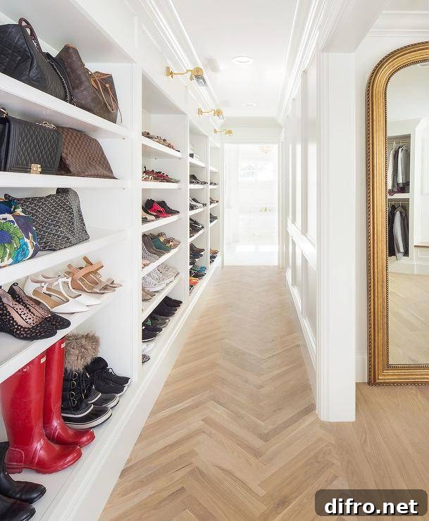 Custom walk-in closet shelves organize shoes and accessories into a perfect display