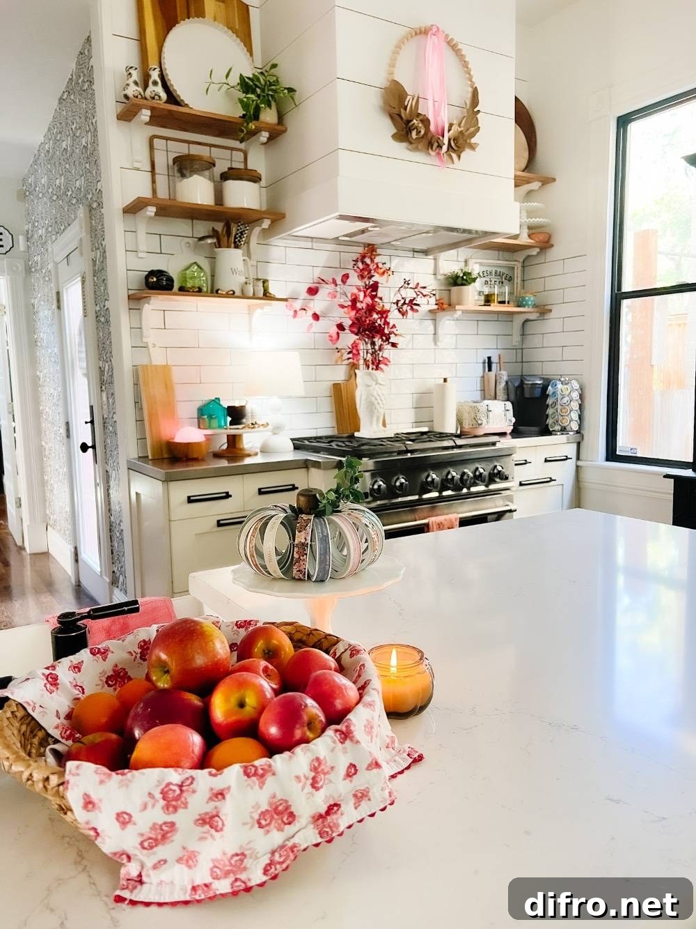 Kitchen counter with jar-lid pumpkin and basket of apples