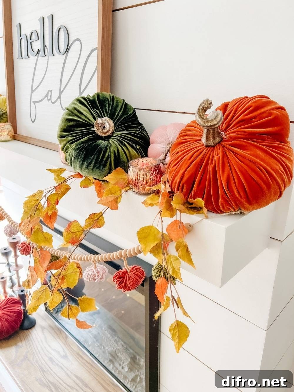 Velvet pumpkins in rich fall colors on a mantel