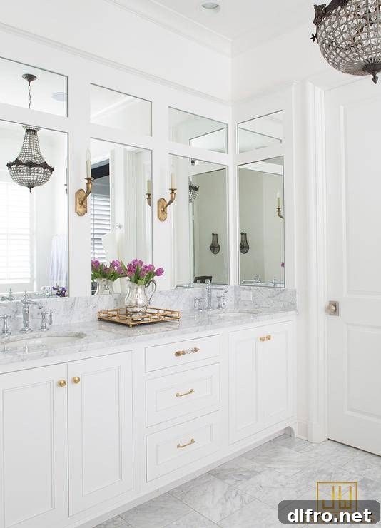 A brass mirrored tray on a white dual vanity.