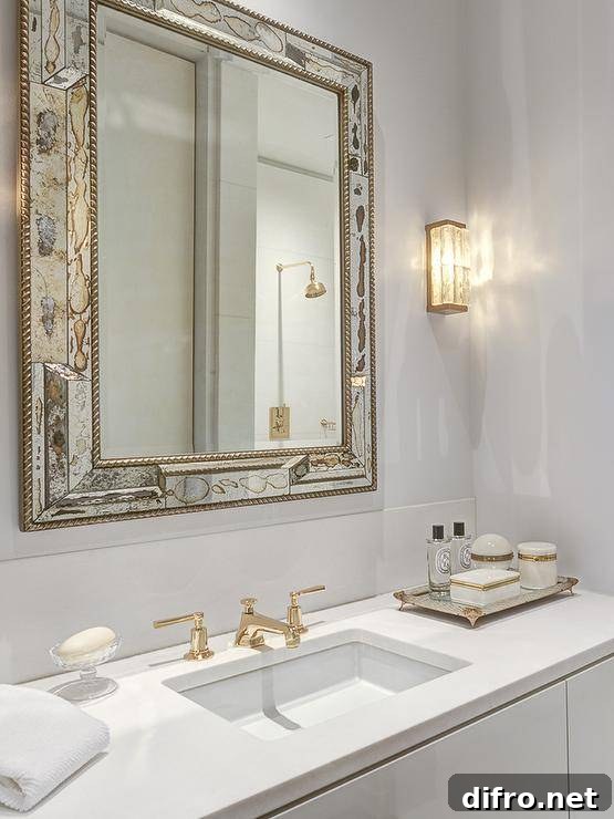 Antiqued mirrored footed tray on a white washstand.