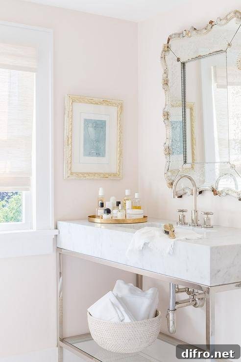 Round gold tray on a marble vanity surface.