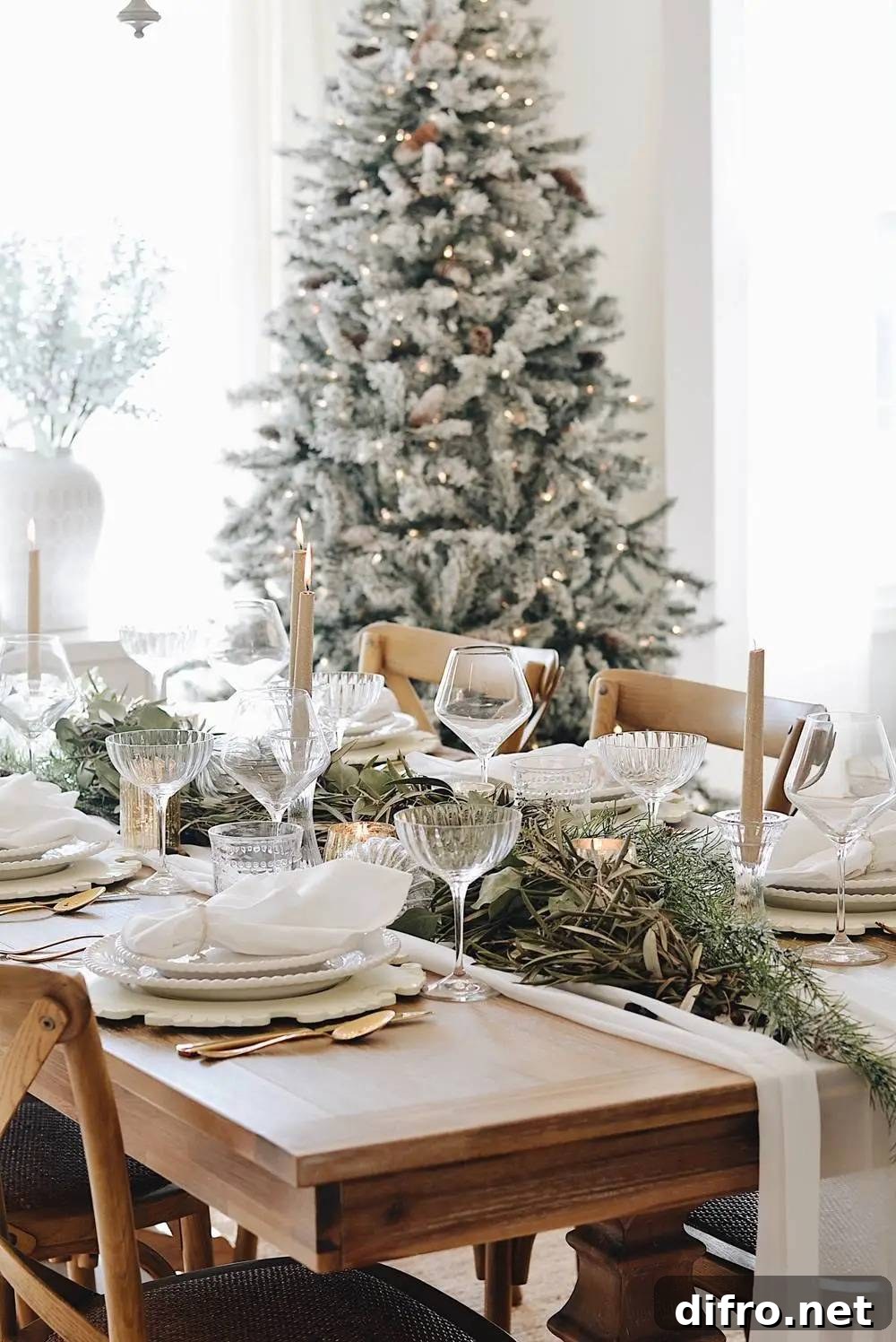 White and gold elegant holiday table with herb sprigs