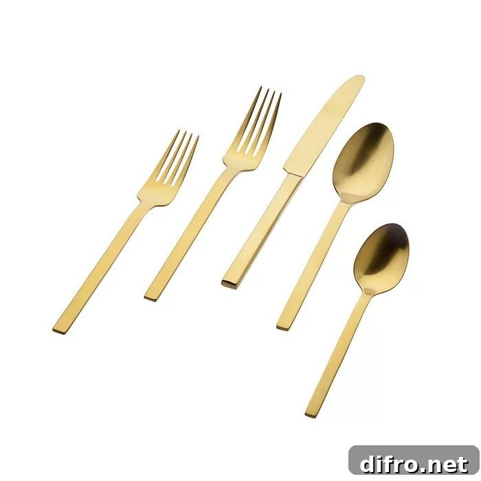 Gold flatware on a festive table setting