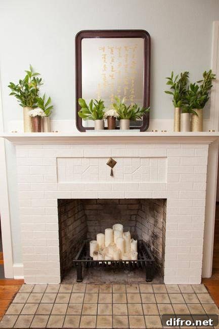 metal stand in fireplace with pillar candles
