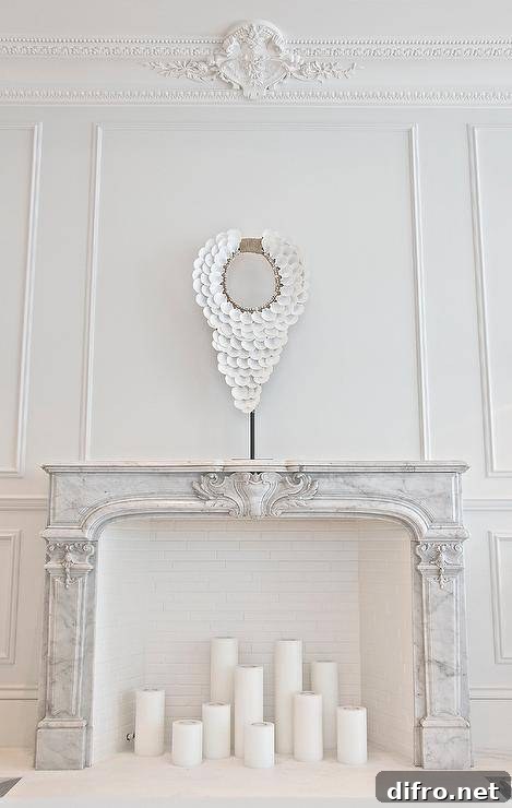French living room with a marble fireplace filled with candles