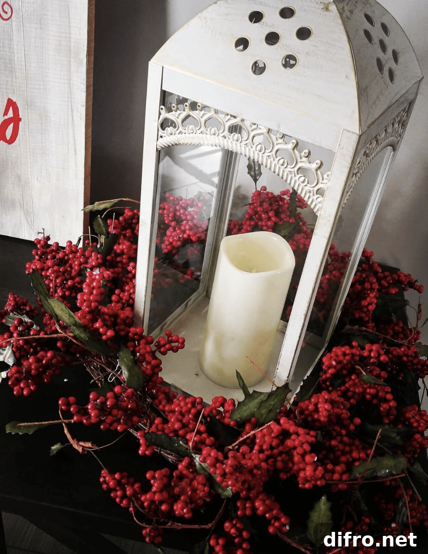 red berry wreath around a white lantern