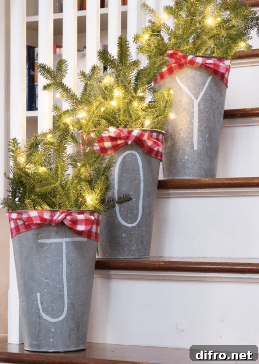 light up greenery in buckets joy on stairs