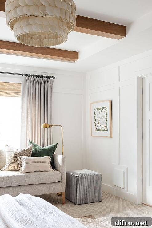 Gray living space with board and batten walls and layered window treatments.