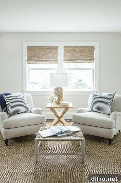 Neutral seating area with bamboo shades and rattan accents.