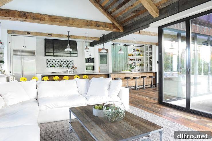 White plush sectional sofa is surely a place to relax and unwind in an open concept, transitional living space.