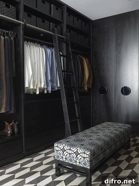 Modern black oak closet with ladder, woven baskets and black-and-white flooring.