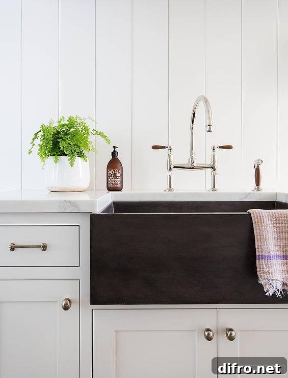 Cottage mudroom with a black fireclay apron sink
