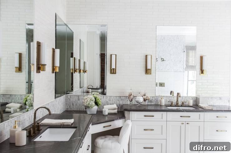 Black and white his-and-hers vanities with soapstone countertops and wraparound corner vanity
