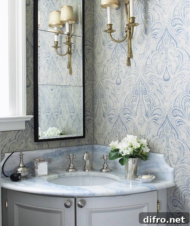 Blue and gray bathroom with gray corner bow front vanity and blue stone countertop