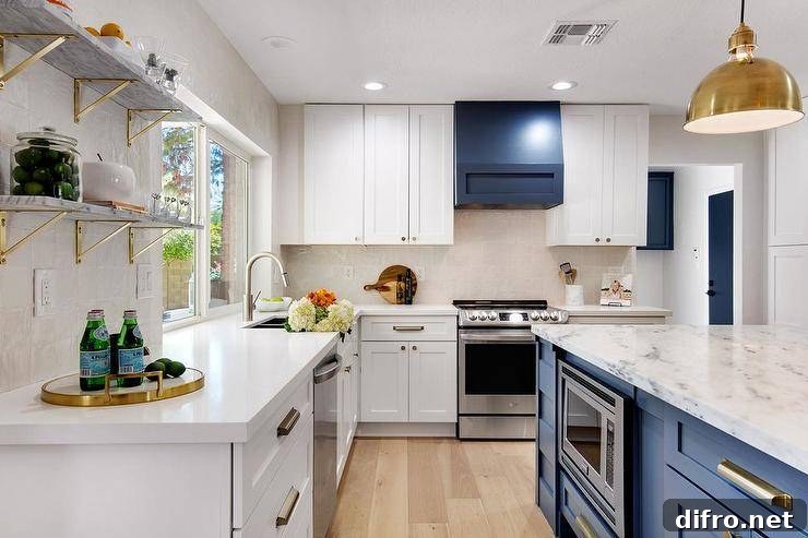 Transitional white and gold kitchen with a blue wooden range hood