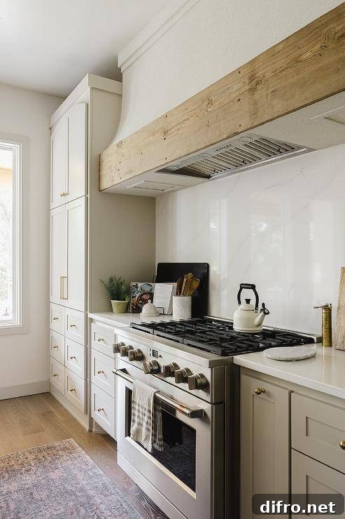 White range hood with reclaimed wood trim over a marble-look backsplash