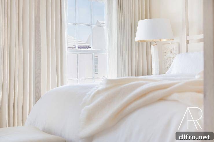Contemporary white and ivory bedroom with antique white walls