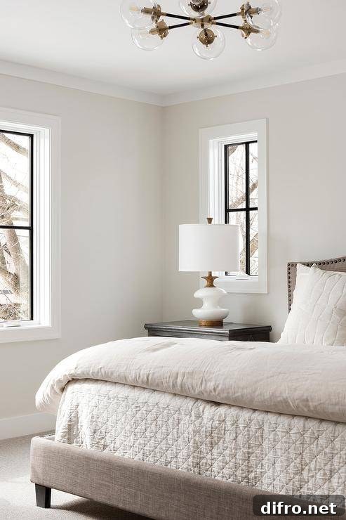Transitional bedroom with beige linen bed and soft neutral palette