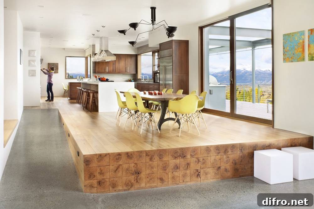 raised wooden platform with kitchen table and yellow chairs