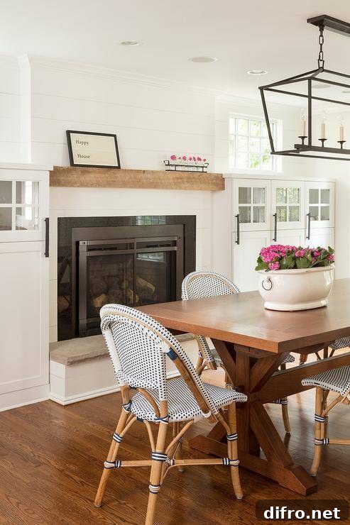 Trestle dining table with simple blue chairs in a cottage interior