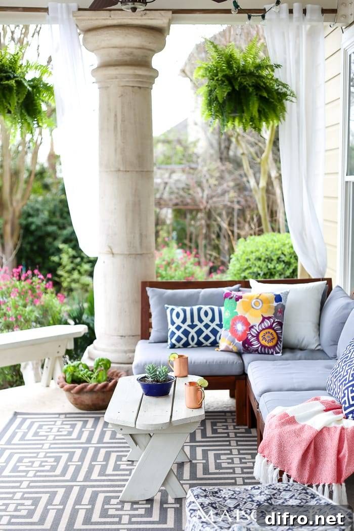 outdoor patio with geometric rug and colorful pillows