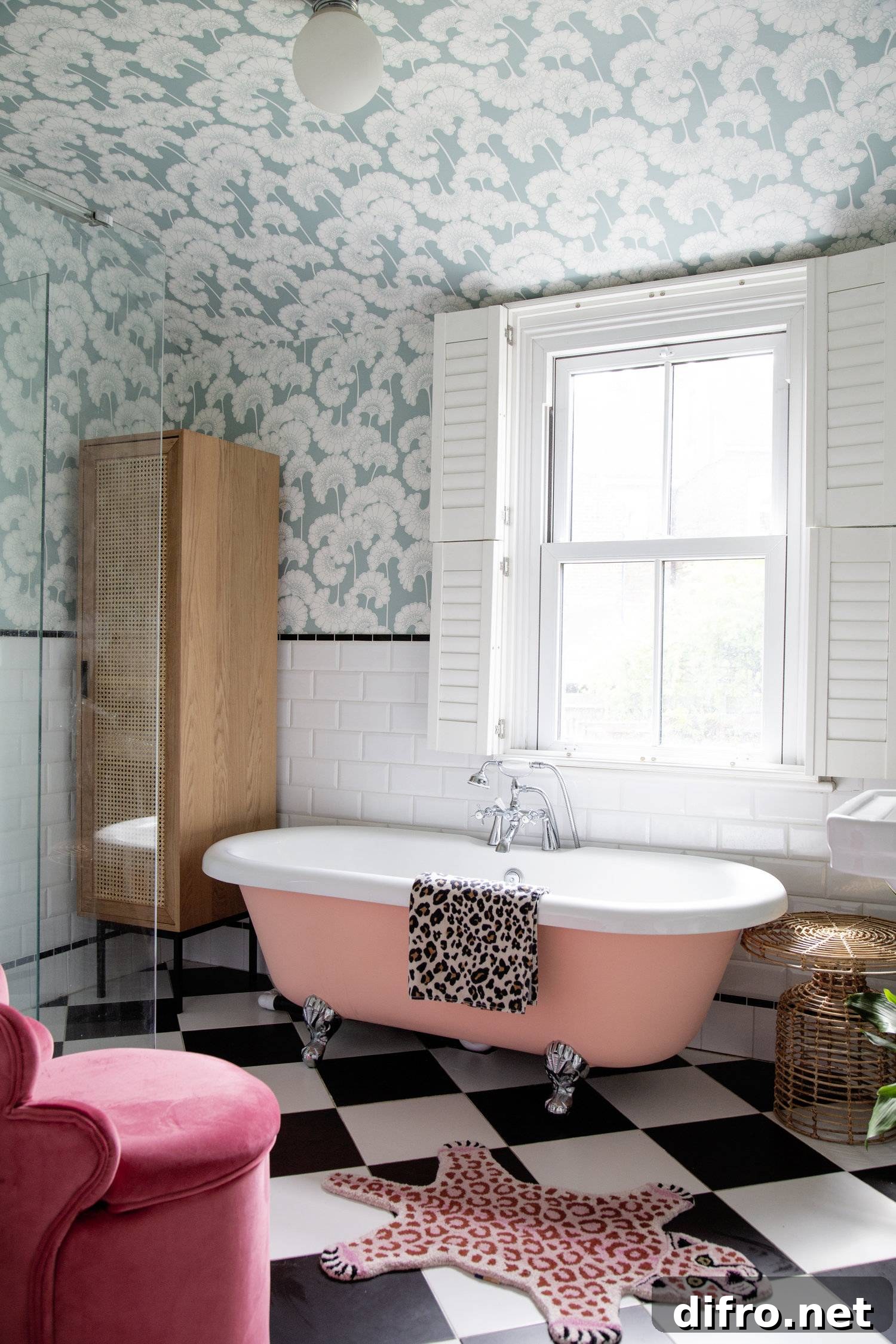 bathroom with turquoise and white wave wallpaper, pink bathtub, leopard print accents, white wooden window shutters