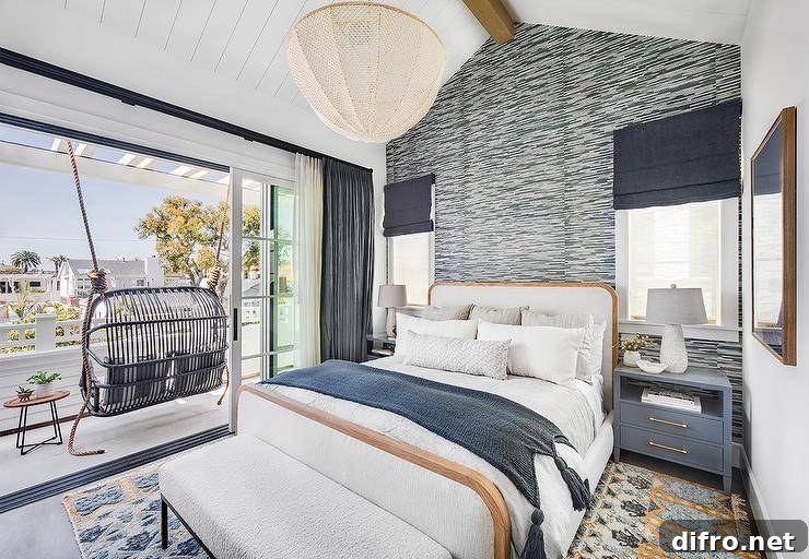 Bedroom with patterned wallpaper, rattan swing and white linen bed