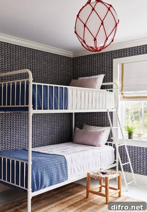 Kids' bedroom with black geometric wallpaper and a white metal bunk bed