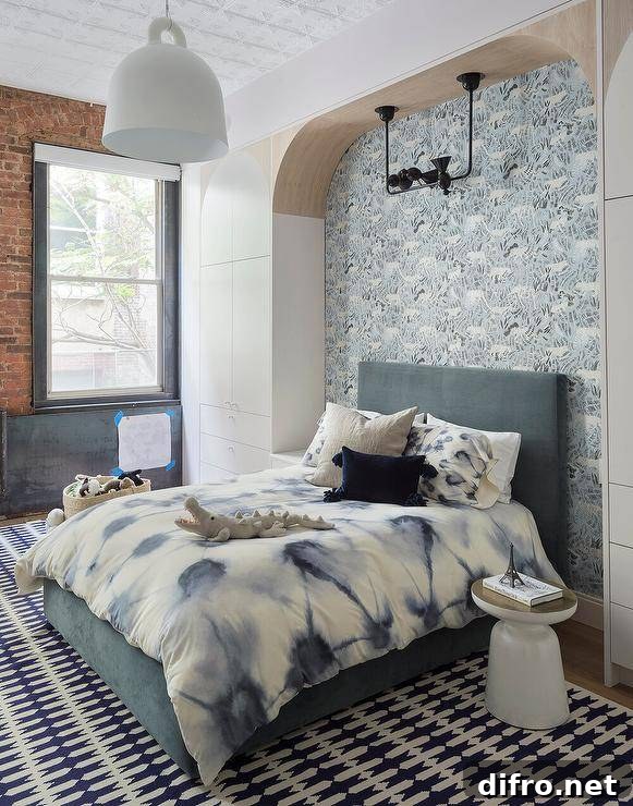 Arched niche with blue and white wallpaper and a dark gray bed