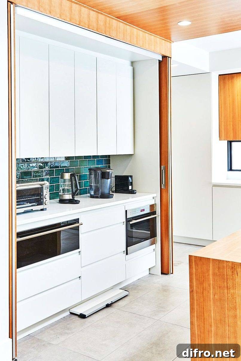 Hidden white kitchen small alleyway green subway tile
